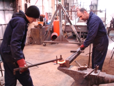 Carl and Martin forming the reed shapes using the jig