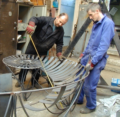 Martin and Carl working on Ironstone Bench, designed by Adrian Moakes