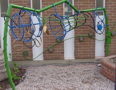 Colourful rocket shaped frame, part of a 'sensory garden' for children with disabilities, designed by Alan Birch